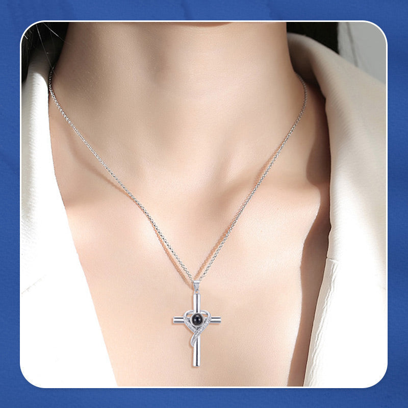 Cross necklace with "I love you" projection in 100 languages