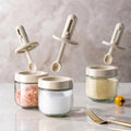 Spice jar with retractable spoon