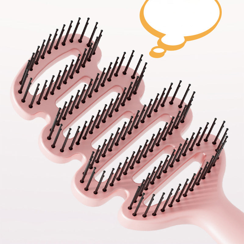 Curved hairbrush with ventilation