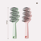 Curved hairbrush with ventilation
