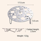 Silver-colored steamer rack in stainless steel with support for cooking