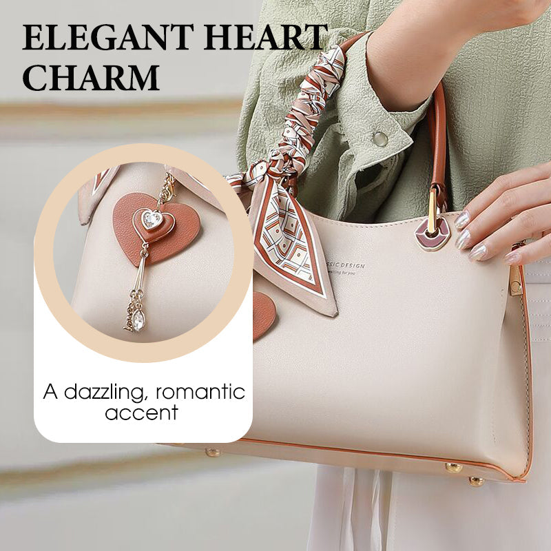 Elegant women's handbag with sparkling heart pendant