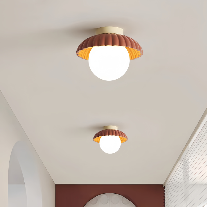 Ceiling lamp with a milk glass shade providing warm lighting in the hallway
